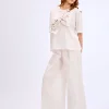 white-t-shirt-oversized-hand-painted-bow-simbol-1